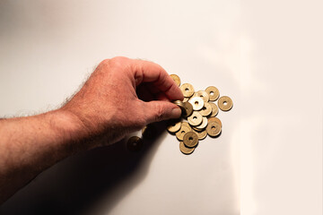Hand counting japanese yen coins for financial planning