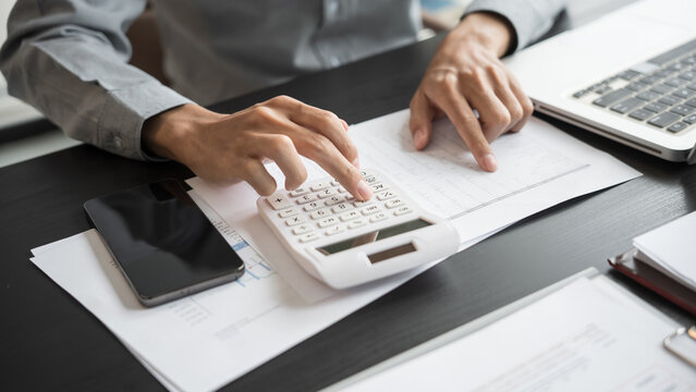 Business man accountant financial analyst and auditor working and laptop for calculating 