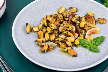 Fried mussels seasoned.