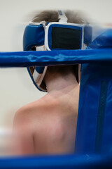 Abstract composition on combat sports - boxing ring corner with fighters - silhouette and motion blur