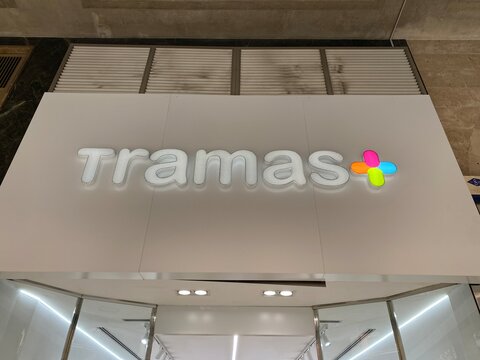 Palma De Mallorca, Spain - October 30, 2025: Tramas store sign illuminated in a modern shopping center, showcasing vibrant colors and contemporary design elements with copy space