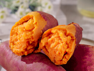 Fresh Red Sweet Potatoes Cut Open Showing Orange Flesh - Healthy Root Vegetables Food Photography