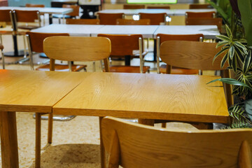 Food Court with Wooden Tables and Chairs in a Shopping Mall