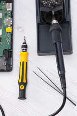 electric soldering iron for repair, screwdriver for diagnostics and repair of gadgets