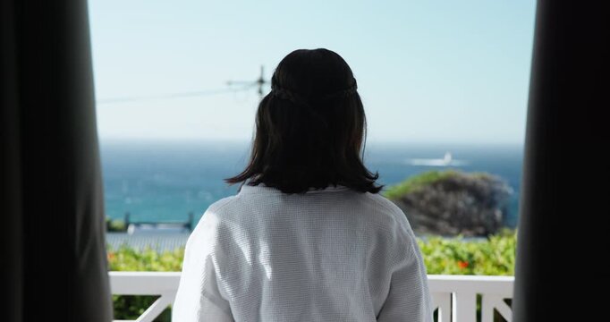 Travel, woman and open window for balcony, freedom and luxury accommodation with ocean, view or sunrise. Hotel, back and curious girl in Bahamas for vacation, holiday or resort hospitality at the sea