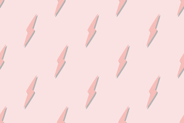 Minimalist repeating pattern of pink lightning bolts with a drop shadow on a pastel pink background.