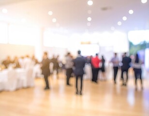 Blurred crowd gathers in bright event hall with hard floors