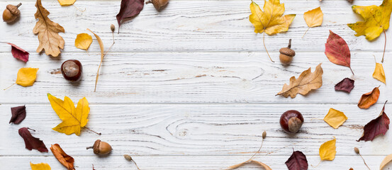 Autumn composition made of dried leaves, cones and acorns on table. Flat lay, top view