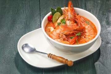 Tom yum goong or tom yam is a family of hot and sour Thai soups