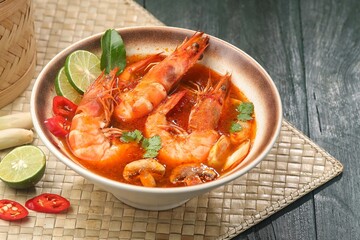 Tom yum goong or tom yam is a family of hot and sour Thai soups