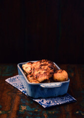  Fried chicken breast with potatoes. Rustic wooden background. Soft focus.