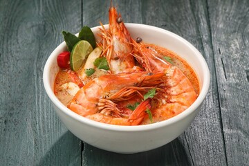 Tom yum goong or tom yam is a family of hot and sour Thai soups