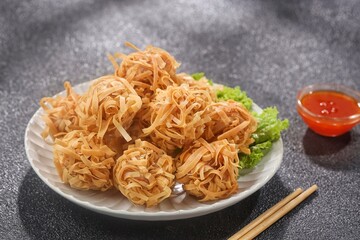 Udang Rambutan. Rambutan Shrimp is a type of fried dimsum, ball-shaped and filled with chopped chicken and shrimp.