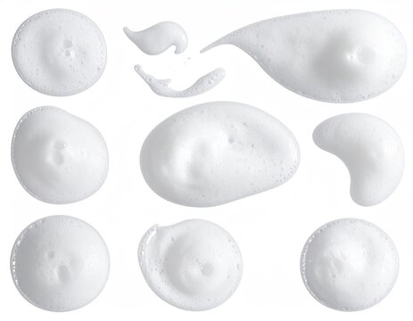 Various blobs of fluffy white foam, isolated on white - Powered by Adobe