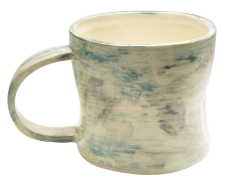 Handmade ceramic coffee or tea mug isolated on white background with clipping path. Artistic pottery cup with natural glaze texture for hot drinks or home decor PNG File.