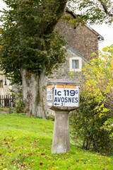 Obraz premium Old French village signpost guiding to AVOSNES