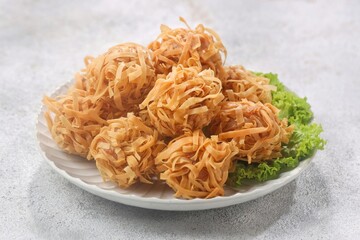 Udang Rambutan. Rambutan Shrimp is a type of fried dimsum, ball-shaped and filled with chopped chicken and shrimp.