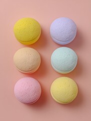 Obraz premium Colorful Ice Cream Scoops in Playful Pastel Tones Arranged on a Light Pink Background