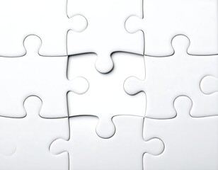 Close-up of interlocking white puzzle pieces on a neutral background