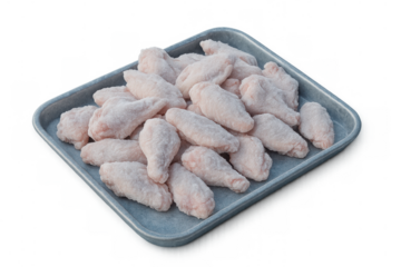 Frozen chicken wings on a metal tray, raw poultry meat for cooking preparation, isolated with transparent background