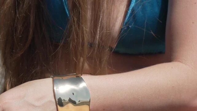 Woman hands jewelry unpacking, opening small box outdoors, fashion beauty concept