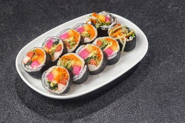 Kimbap or gimbap is a typical Korean rice roll