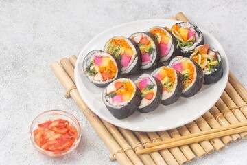 Kimbap or gimbap is a typical Korean rice roll