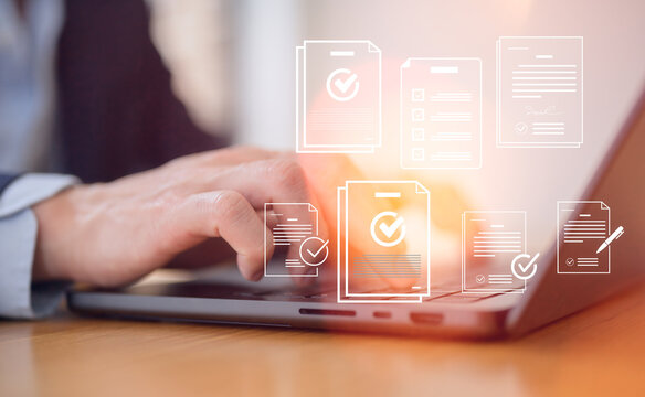 Businessman using laptop for digital document management corporate management approval concept, paperless workflow automation business process efficiency project authorization