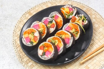 Kimbap or gimbap is a typical Korean rice roll