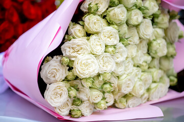 A huge bouquet of white roses. Flower delivery.
