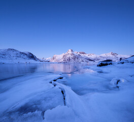 Obraz premium Norway. Nature in the fjords during winter. High mountains, ice and reflections. Scandinavia. Vacation and travel in the winter north. Background, wallpaper, postcards.