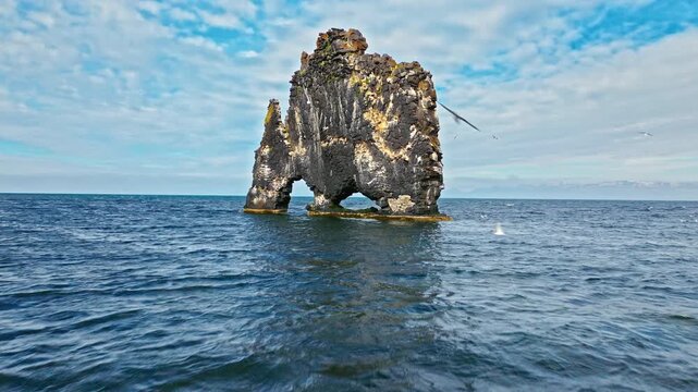 Aerial view of Hvítserkur basalt sea stack, Iceland. Iconic natural landmark along the North Icelandic coastline.