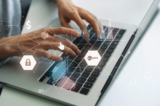 Hands typing on laptop with cybersecurity and finance icons