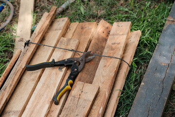 Tin Snips and Wire on Wooden Planks