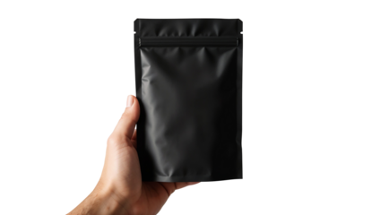 Hand holding black standing pouch packaging isolated on transparent background