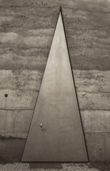 Fototapeta premium massive, triangular-shaped entrance door of a field chapel