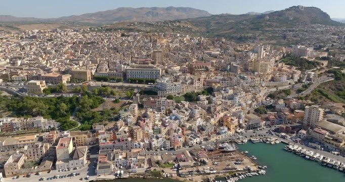 Aerial panoramic view of the town of Sciacca, Sicily, Italy. This village has a small harbor overlooking the crystal-clear waters of the Mediterranean Sea.
