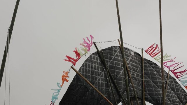 Backside structure of a giant kite with fluttering streamers in Sumpango Guatemala