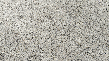 Closeup of a white and porous wall. Ideal for backgrounds, patterns and textures.