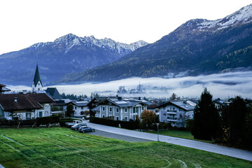 The village of Neukirchen am Grossvenediger in Austria, shrouded in morning fog