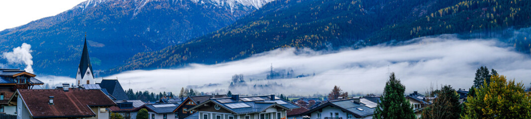 The village of Neukirchen am Grossvenediger in Austria, shrouded in morning fog