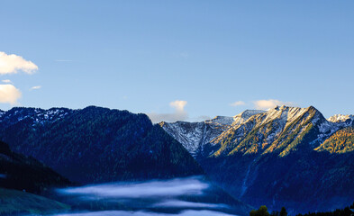 The village of Neukirchen am Grossvenediger in Austria, shrouded in morning fog