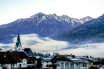 The village of Neukirchen am Grossvenediger in Austria, shrouded in morning fog