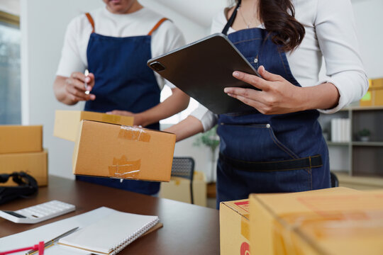 E-commerce. Team packing orders in a modern workspace.