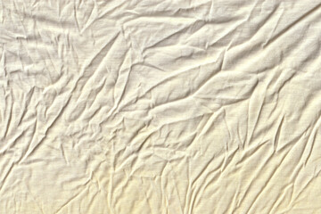 Abstract Background of Heavily Wrinkled Cream Colored Cotton or Linen Fabric.