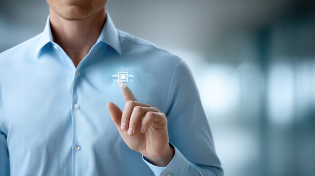 Businessman in light blue shirt touching virtual microchip icon, technology innovation concept, modern office background - Powered by Adobe