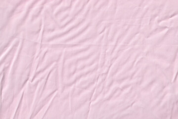 Fototapeta premium Light Pink Wrinkled Fabric or Crumpled Bed Sheet Texture Background.