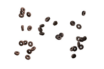 Chocolate rings cereal spill out into a bowl. Breakfast.