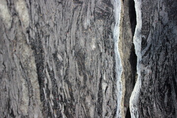 Close-up of rough rock surface with natural crack