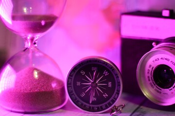Compass hourglass and camera travel search way memory timer concept photo